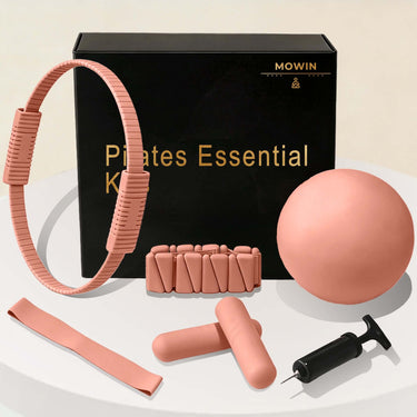 Eco-friendly Pilates Essential Kits including a Pilates ring, ball, resistant band, and dumbbells on display.